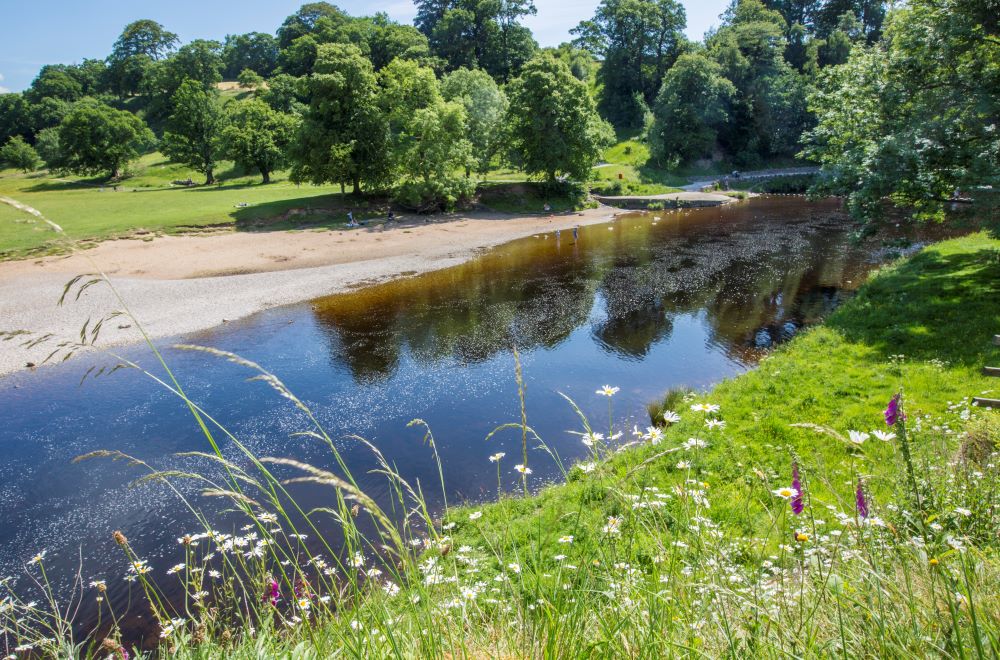 The beautiful River Wharfe gentling flowing past the priory