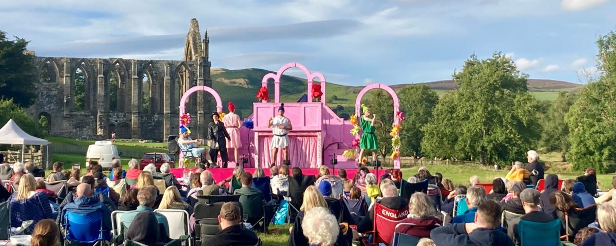 Outdoor theatre at Bolton Abbey on a sunny summer's evening near the priory ruins