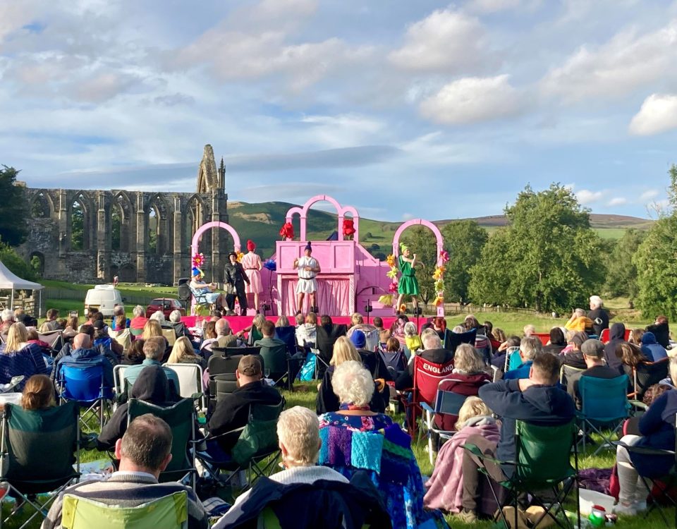 Outdoor theatre at Bolton Abbey on a sunny summer's evening near the priory ruins