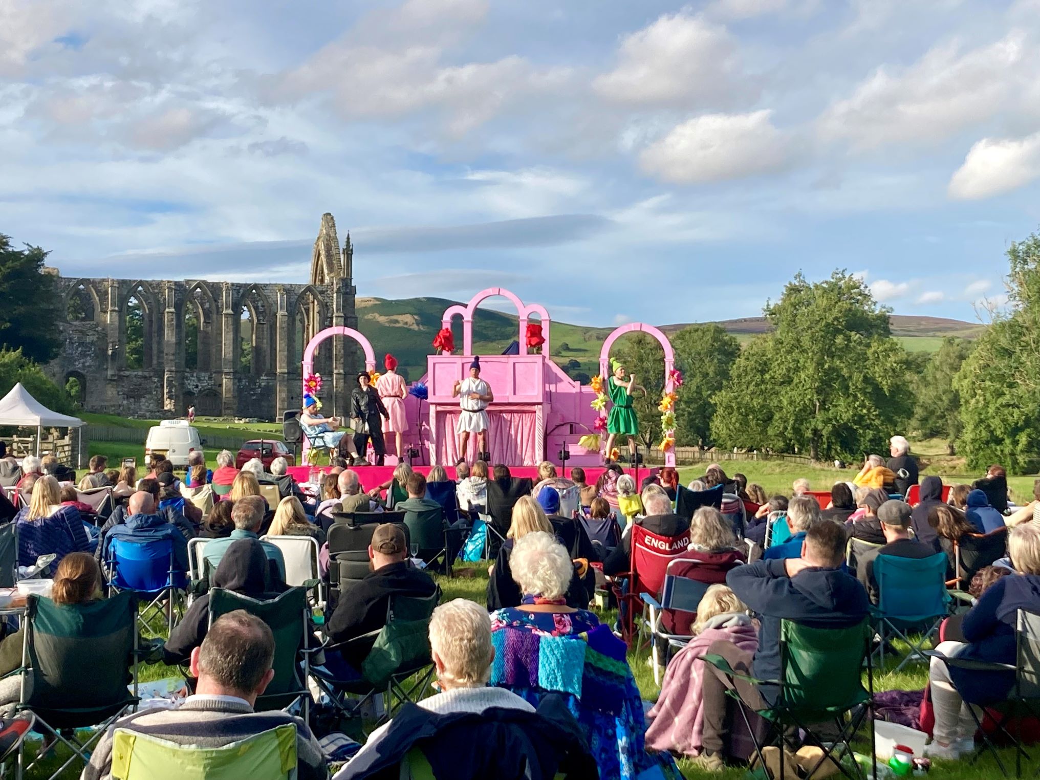 Outdoor theatre at Bolton Abbey on a sunny summer's evening near the priory ruins